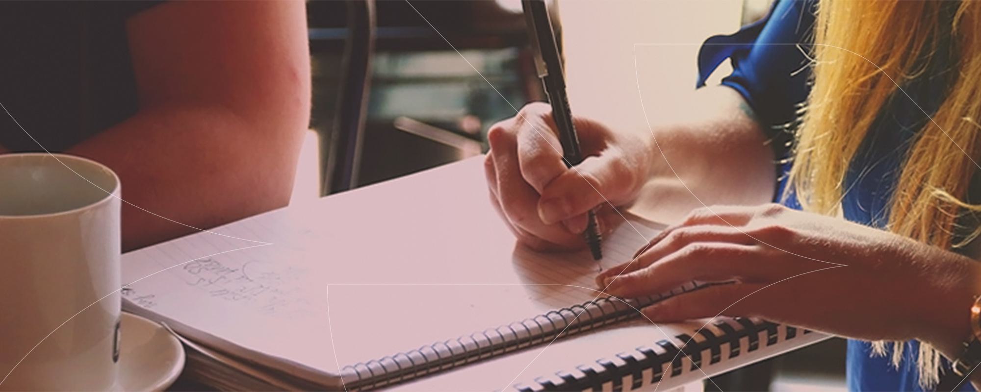 writing in notebook