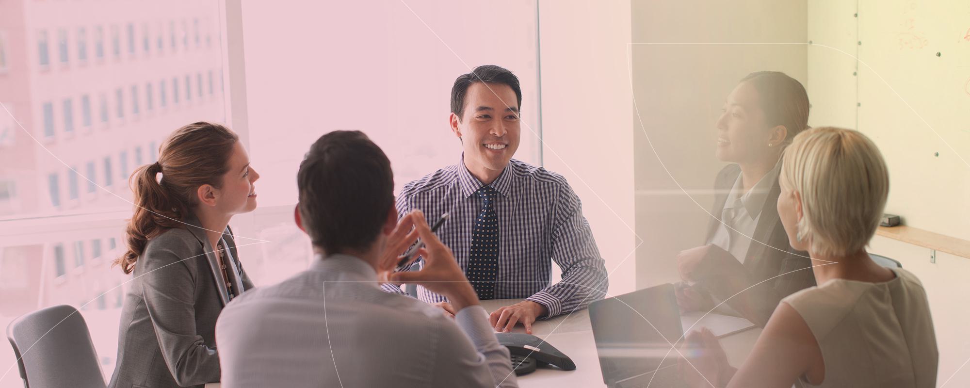 Diverse business team at table Getty Images 167890481