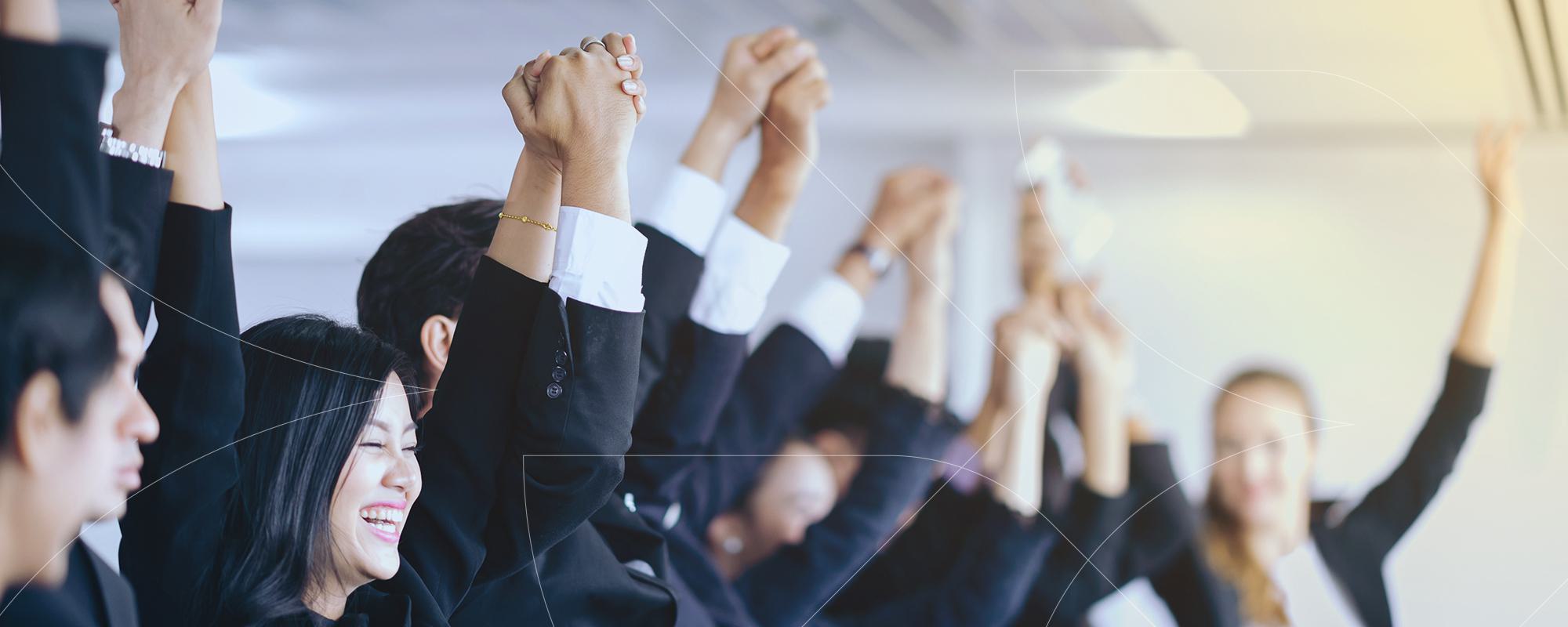 Group with arms raised